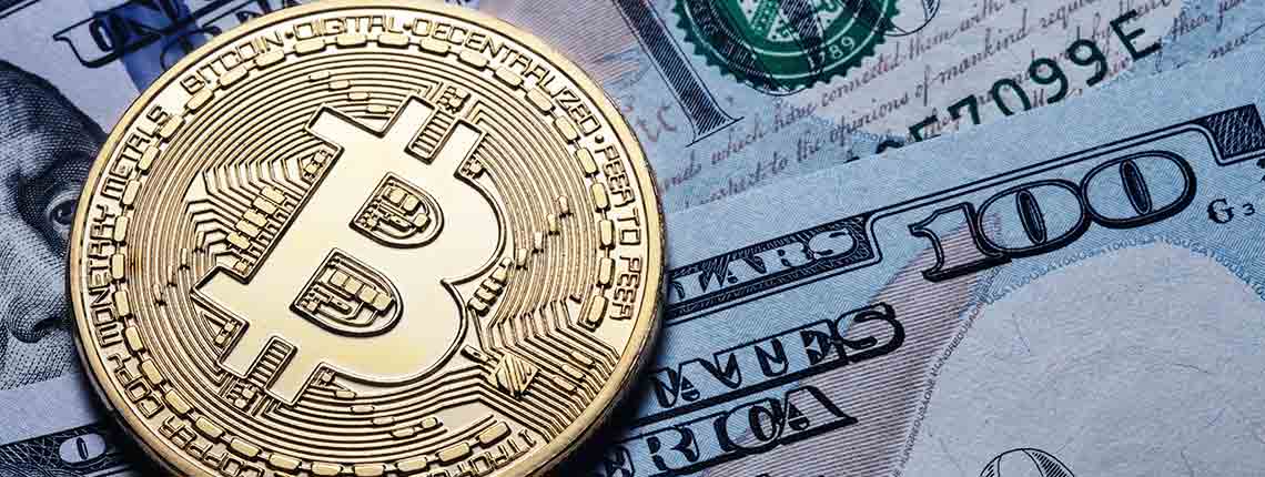 Gold-Bitcoin auf Hundert-Dollar-Scheine